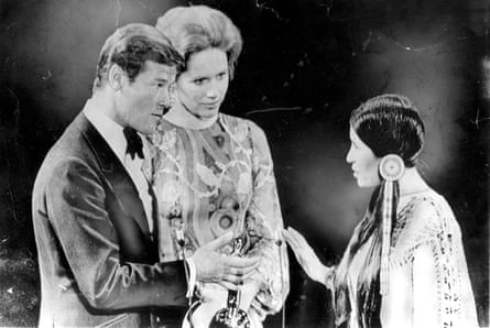 Sacheen Littlefeather declines the best actor Oscar on behalf of Marlon Brando in 1973, as Roger Moore and Liv Ullmann look on. The whereabouts of this Oscar are not known.