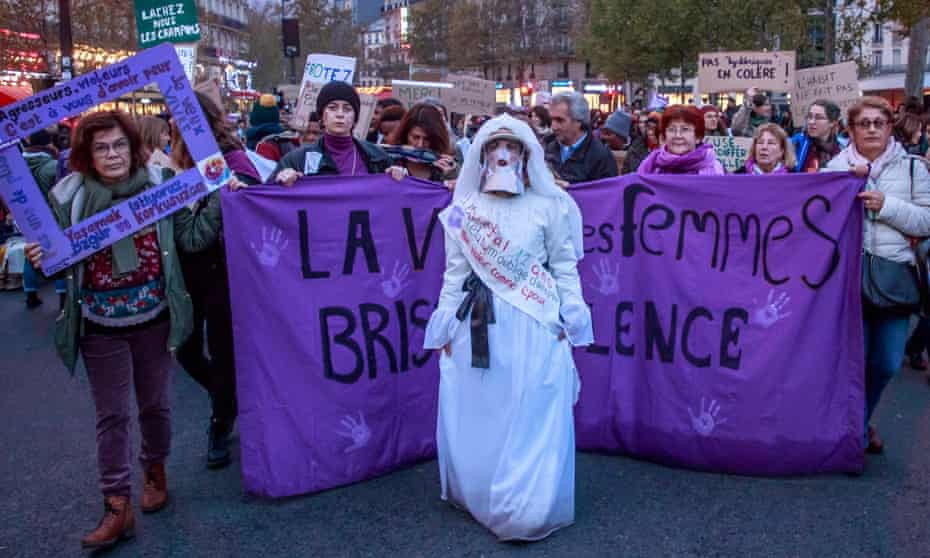 Women in Paris carrying signs saying ‘All of us [women]’ protest against sexual violence.