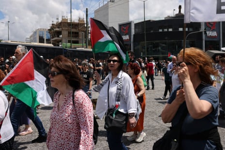 People take part in a pro-Palestinian demonstration outside the Israeli embassy in Athens, Greece, on Saturday.