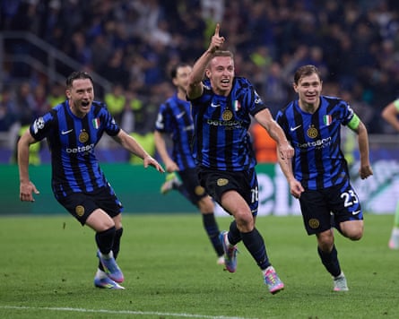 Davide Frattesi, followed by team-mates, runs in celebration of his goal with his right index finger held high