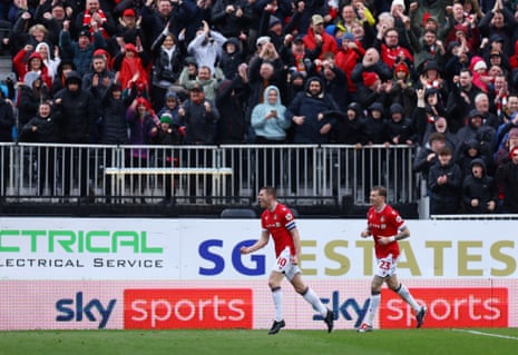 Wrexham's Paul Mullin celebrates scoring their first goal against Mansfield.