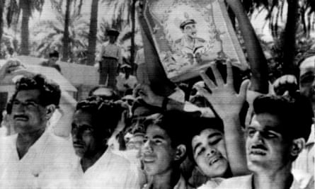 Cheering crowd in Baghdad with portrait of Egyptian president Nasser, 1958.