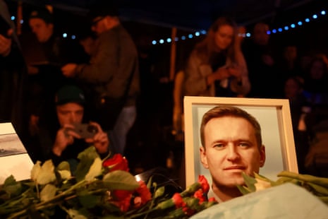 People leave flowers during a vigil for Alexei Navalny at the Russian embassy in Munich, Germany. Dozens have been arrested, observers say.