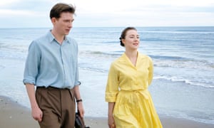 Domhnall Gleeson (left) and Saoirse Ronan in a scene from the film adaptation of Colm Tóibín’s novel Brooklyn.