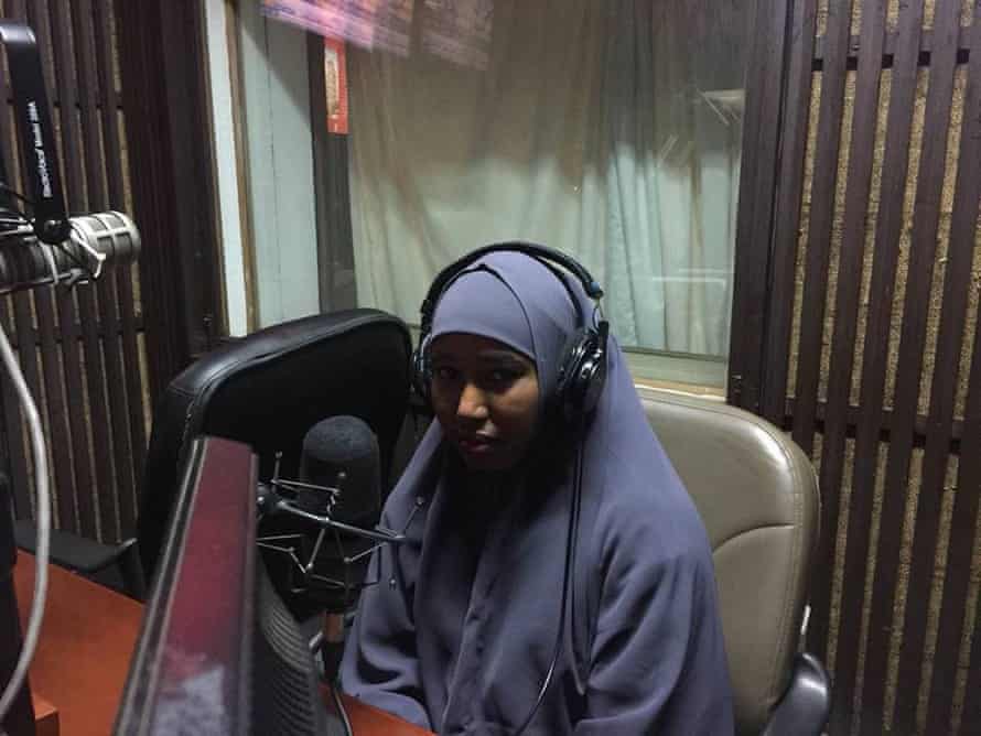 Hussein speaking on the radio in 2018.