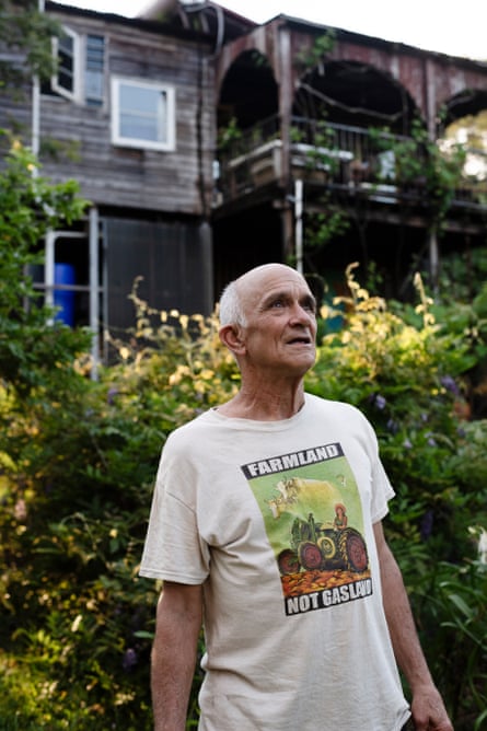 Paul Paitson outside his home wearing a ‘farmland not gas land’ T-shirt