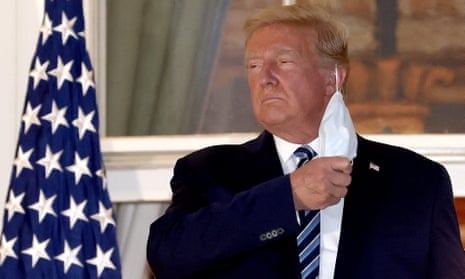 Donald Trump removes his mask at the White House after leaving Walter Reed National Military Medical Center, 5 October 2020.