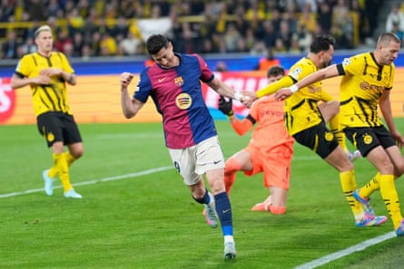 Robert Lewandowski celebrates after an own goal by Dortmund’s Ramy Bensebaini.