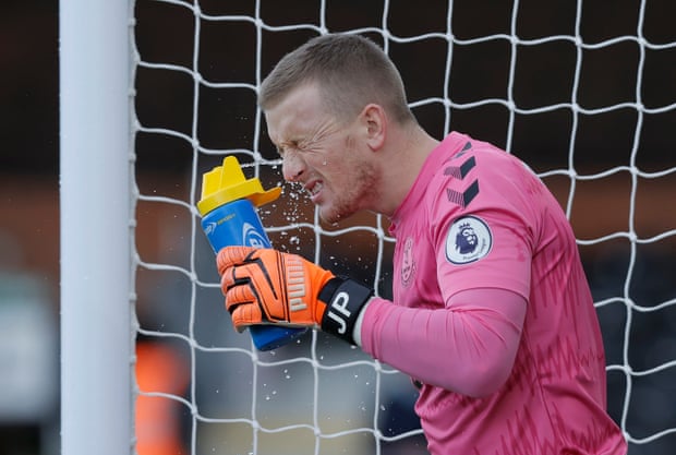 Everton keeper Jordan Pickford sprays water in his eyes just before kick off against Fulham at Craven Cottage.