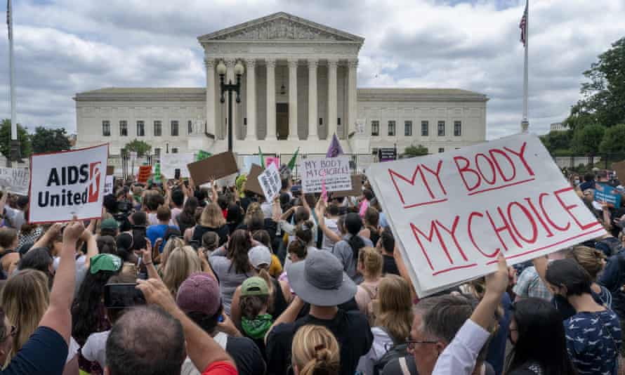 Protesters gather following the supreme court's decision to overturn Roe v.  Wade on Friday.