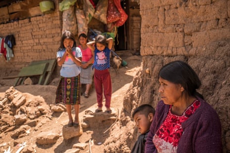 Patrocinia Mejía, 63, at her home with her family