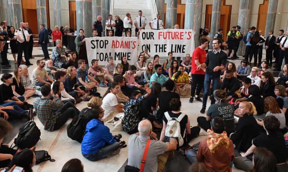 Students protesting the government’s lack of action on climate change stage a sit-in in the marble foyer at Parliament House on Wednesday. 