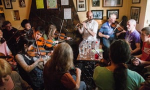 Fiddle and Irish music fans from around the world, including Japanese play in a small village pub