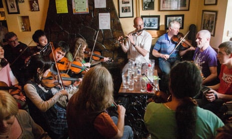 Fiddle and Irish music fans from around the world, including Japanese play in a small village pub