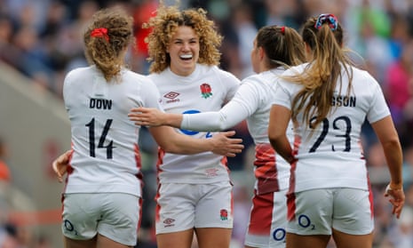 England's Ellie Kildunne (centre) celebrates with her teammates after going over for her second try of the game and England's 11th.