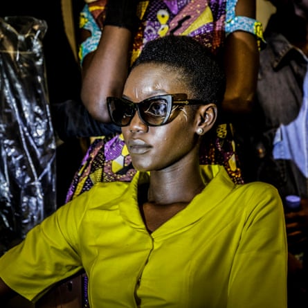 A model waits backstage during Dakar fashion week, June 2017