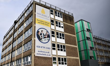 Michaela school in Brent, London. It's a five-storey high brown-brick building with a huge yellow and white banner on the left hand side that advertises the secondary school