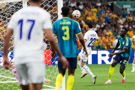 Uzbekistan's Abbosbek Fayzullaev scores a header