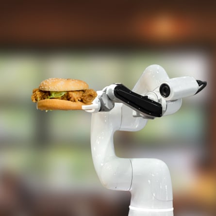 A robotic arm holding a hamburger