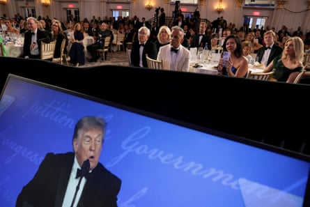 The room of journalists watches as Donald Trump delivers his speech