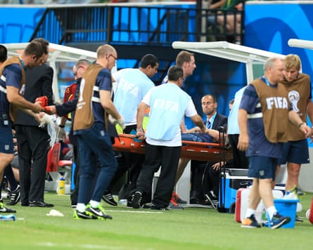 England physio Gary Lewin is carried off injured on a stretcher