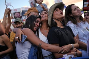 People cheering and hugging