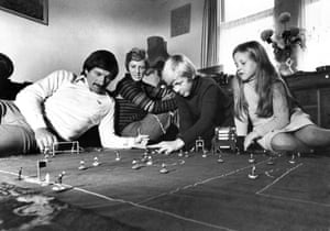 Tommy Smith plays table soccer (subbuteo) with his wife Sue, and children Darren (11) and Janette (8). November 1976