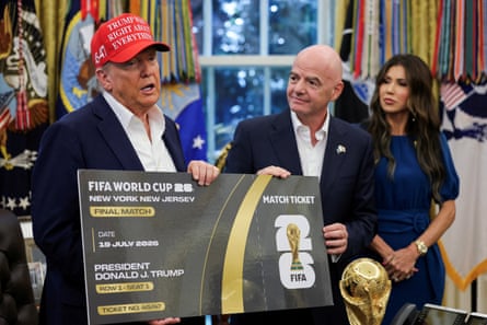 Donald Trump holds a giant 2026 World Cup final ticket next to Gianni Infantino