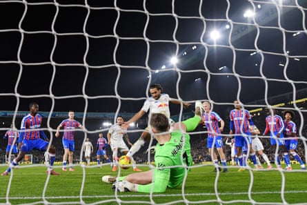 Dominic Calvert-Lewin of Leeds United scores his team's first goal past Crystal Palace keeper Dean Henderson.