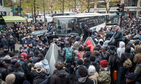 Migrants are evacuated from Paris camp