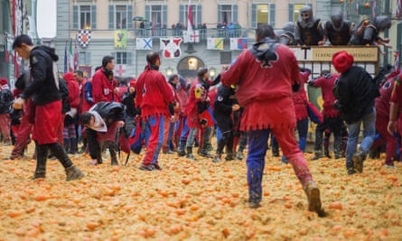 Teams take part in the traditional battle of the oranges held during the Ivrea carnival.