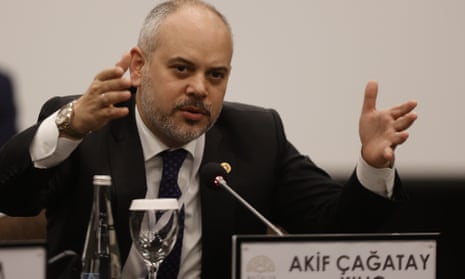 Akif Çağatay Kılıç speaking into microphone.