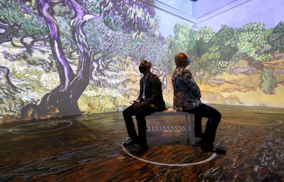 Guests view the Immersive Van Gogh Exhibit during a media preview at SVN West, one of the first in-person art experiences in San Francisco as the city reopens.