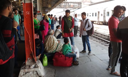Ajish checking children on a platform at Old Delhi railway station