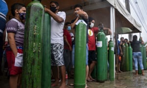 Relatives of patients infected with Covid-19 line up to fill the oxygen tanks of the Carboxi company in Manaus, in the state of Amazonas, Brazil.  (Photo by Marcio James / AFP via Getty)