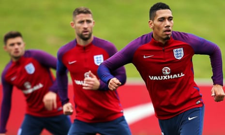 England’s Chris Smalling, right, has yet to start a league game this season, unlike his fellow defenders Gary Cahill and Aaron Cresswell.