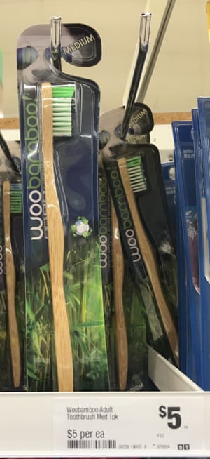 A bamboo toothbrush completely packaged in plastic