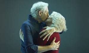 A senior couple kissing