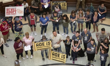 Anti-abortion rights demonstrators gather in the rotunda at the capitol in Austin, Texas. 