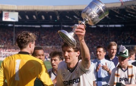 Luton Town striker Mick Harford celebrates with the trophy at Wembley.