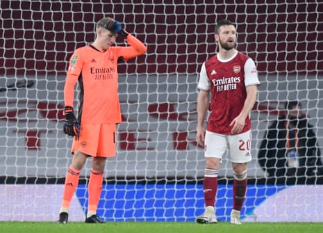 Arsenal’s keeper Runar Alex Runarsson and Shkodran Mustafi look dejected after Aymeric Laporte scored Manchester City’s fourth goal.