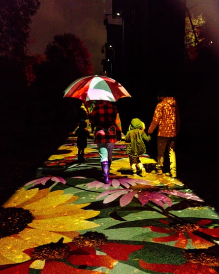 Visitors enjoying the installations along Kew Gardens festive light trail.