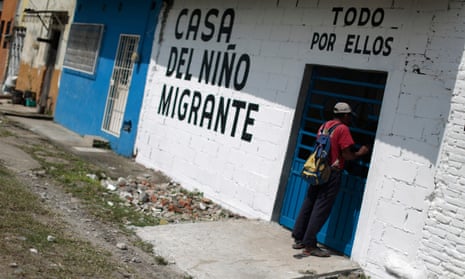 A man stands at the door of the Todo por Ellos (All for Them) migrant shelter in Tapachula, Chiapas, in southern Mexico
