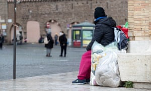 A homeless person living under the colonnade in front of St Peter’s Square in Rome