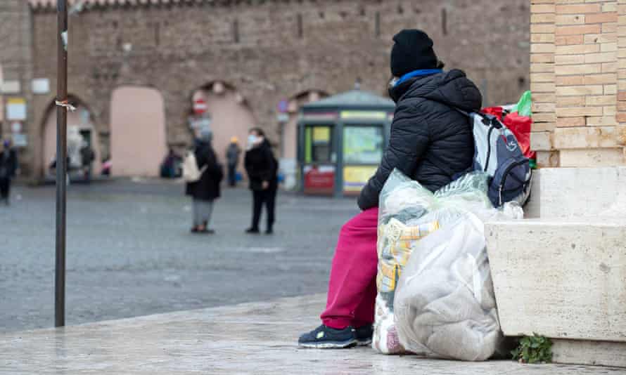 A homeless person living under the colonnade in front of St Peter’s Square in Rome.