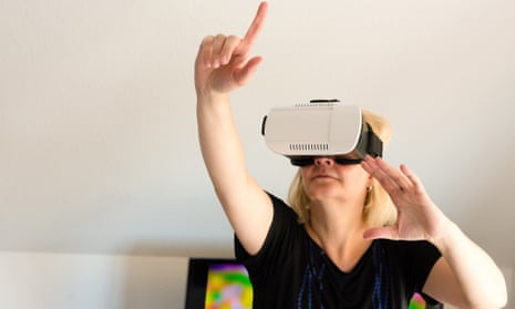 For real? A woman tries out a virtual reality headset.