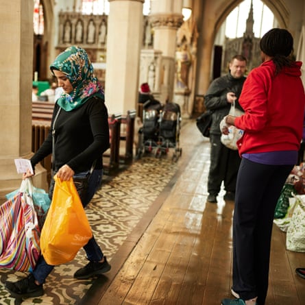 Food parcels and domestic goods being handed out at the parish church of St Vincent de Paul in Liverpool by Micah Foodbank