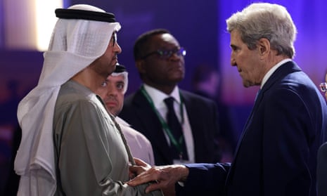 US climate envoy John Kerry speaks with UAE minister of state and CEO of the Abu Dhabi National Oil Co, Sultan al-Jaber, in Abu Dhabi, on 14 January.