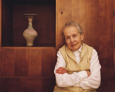 Lucie Rie with a pot