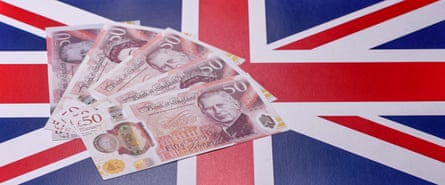 a union flag with five £50 notes spread across it